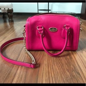Small pink coach bag with strap